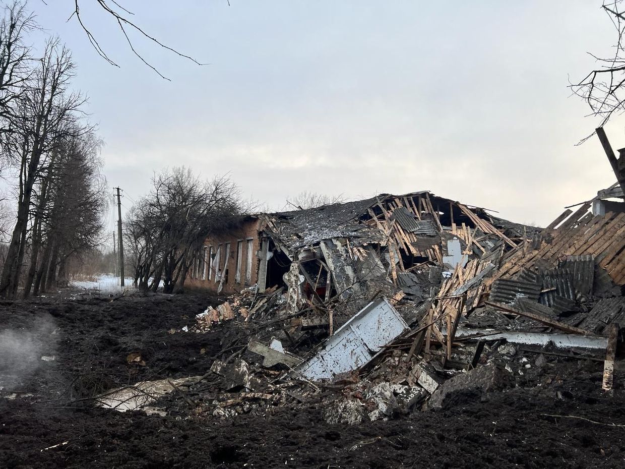 A destroyed building in a field

Description automatically generated