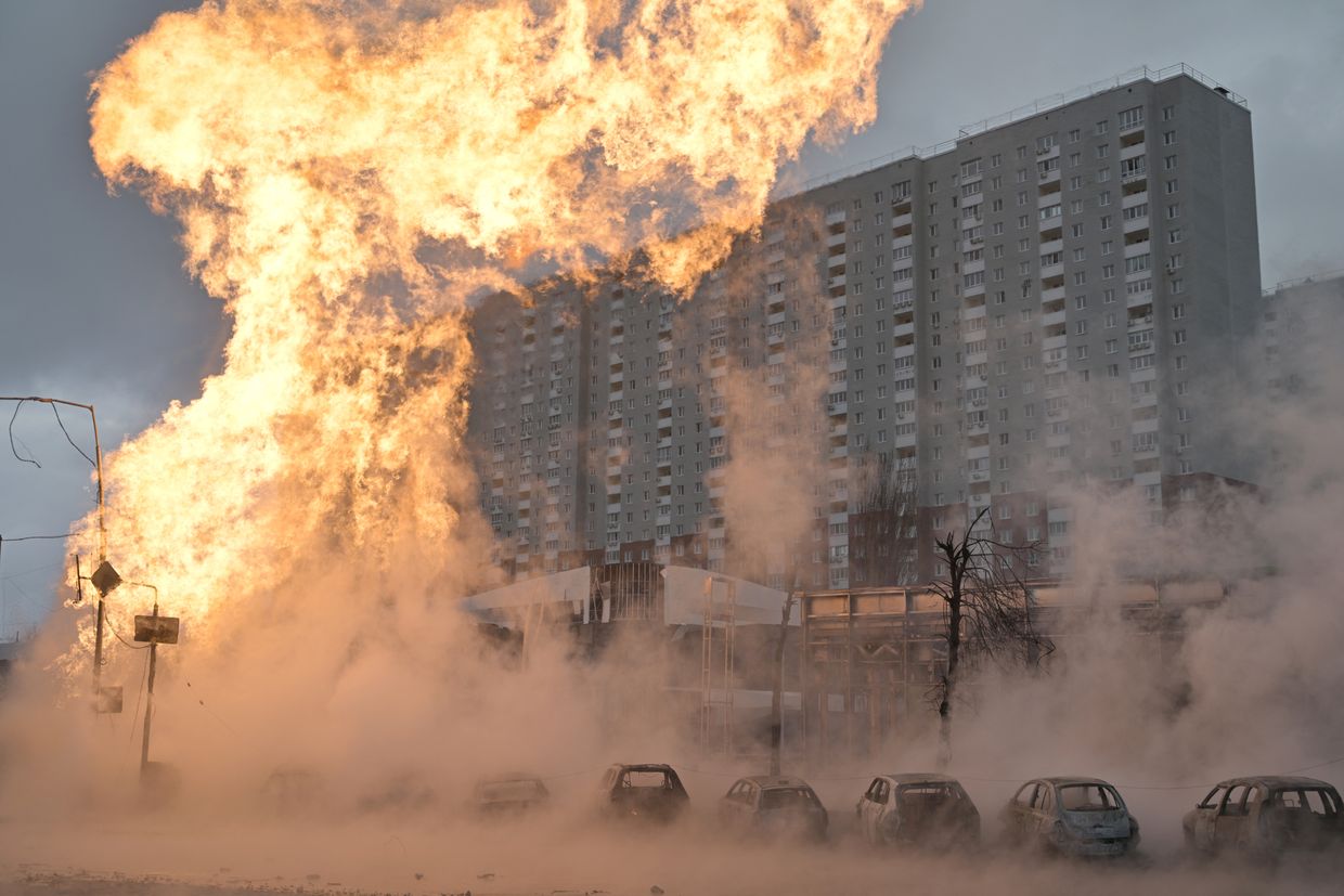 A fire in front of a building

Description automatically generated