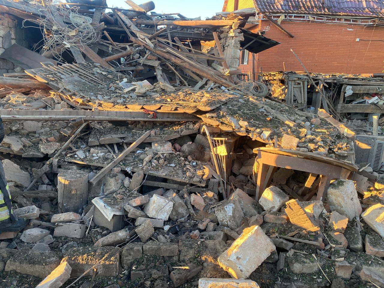 A pile of rubble and debris with Cappadocia in the background

Description automatically generated