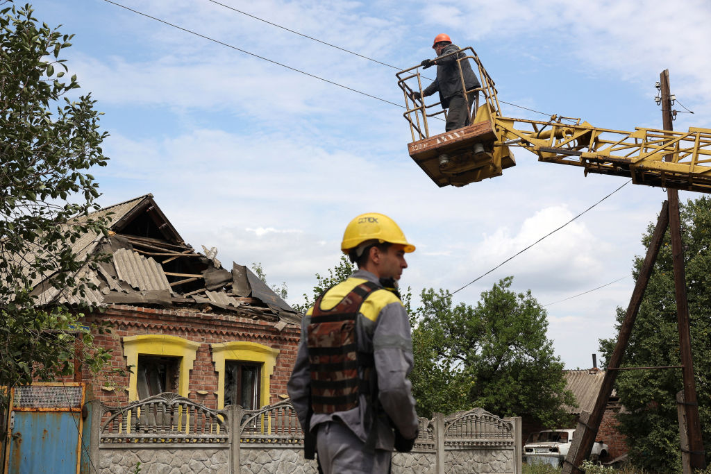 A construction workers in a crane

Description automatically generated