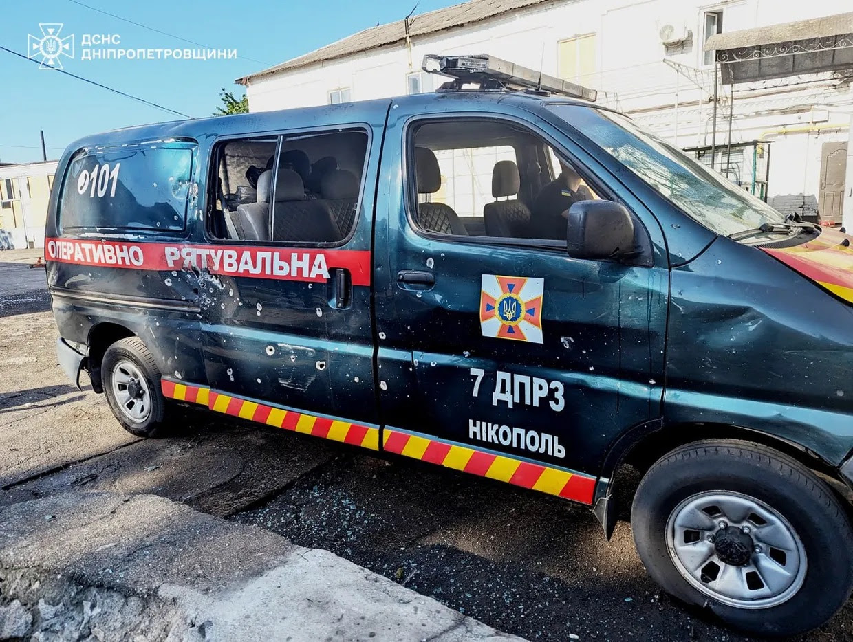 A van with bullet holes on the side

Description automatically generated