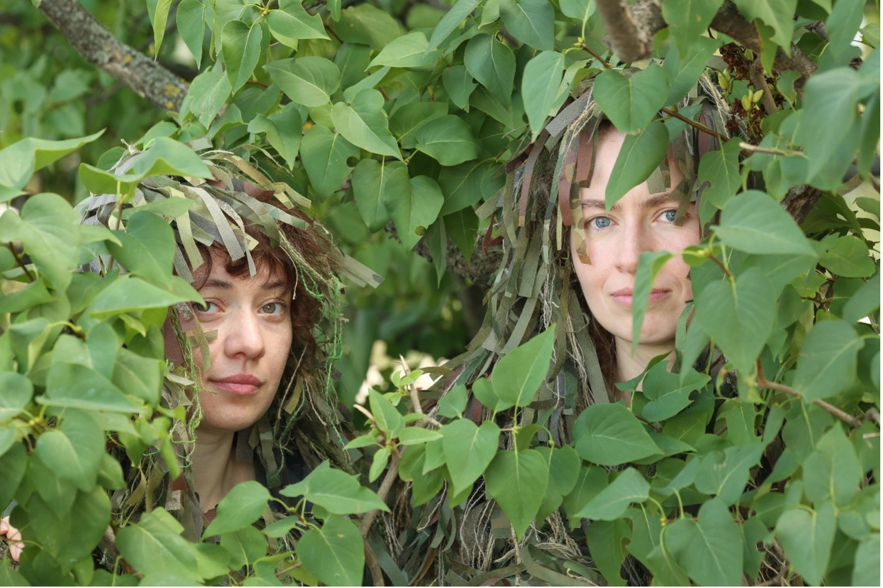 A couple of women in camouflage

Description automatically generated