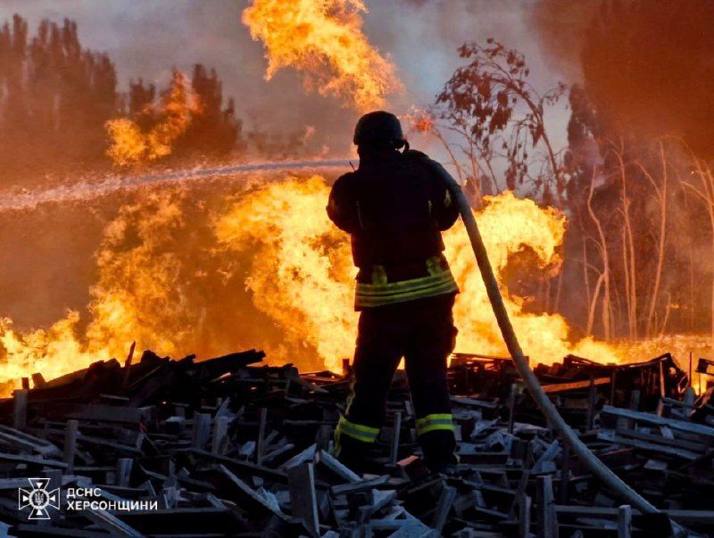 A firefighter putting out a fire

Description automatically generated