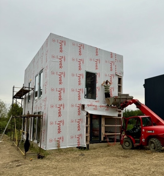 A person standing on a building

Description automatically generated