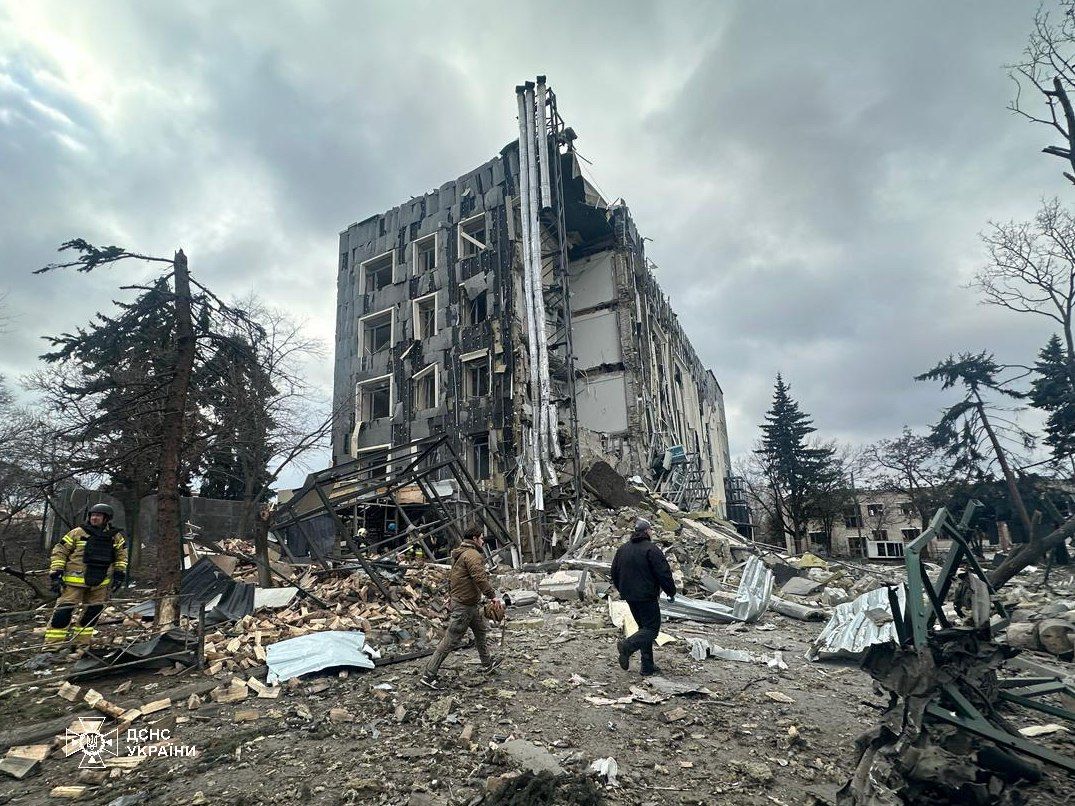 A group of people walking in front of a destroyed building

AI-generated content may be incorrect.