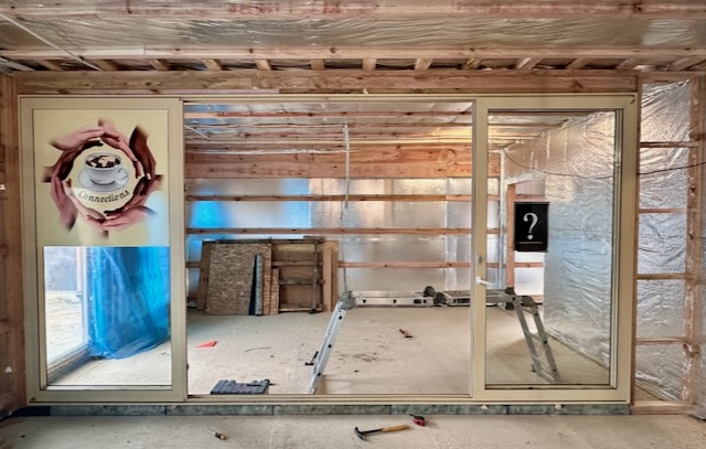 A room with a ladder and a poster

AI-generated content may be incorrect.