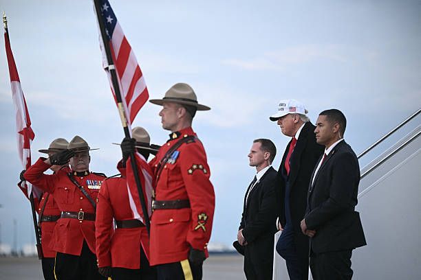 A group of men in suits holding a flag
AI-generated content may be incorrect.