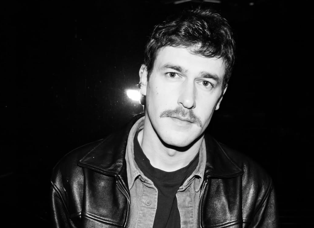 A person with a mustache
AI-generated content may be incorrect.