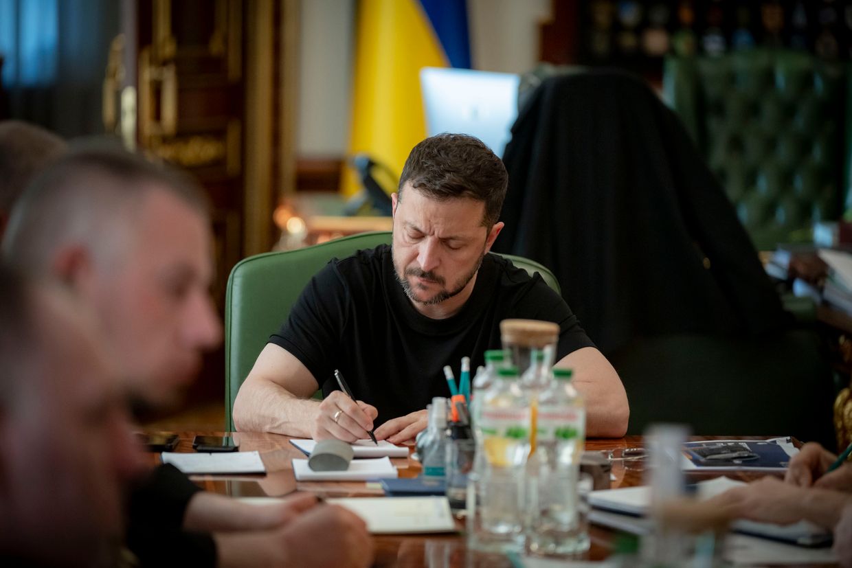 A person writing on a paper
AI-generated content may be incorrect.