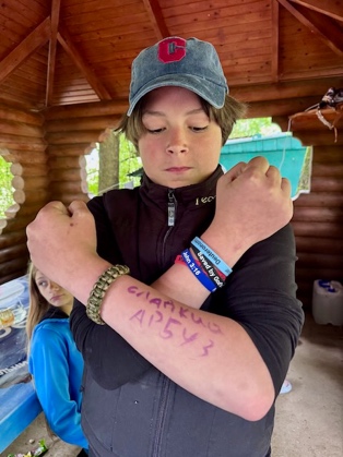 A child with his arms crossed

AI-generated content may be incorrect.