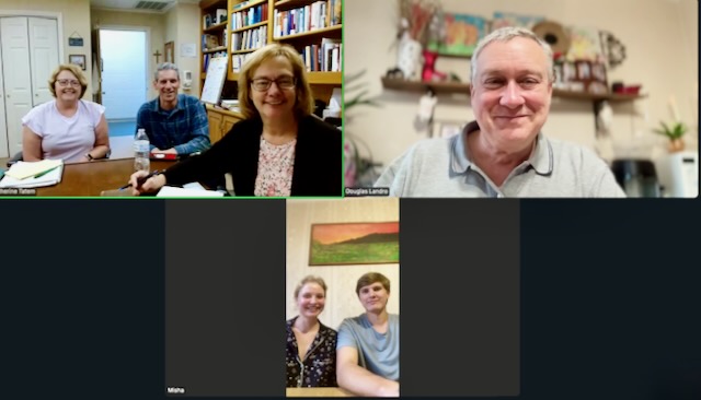 A group of people in a room AI-generated content may be incorrect.