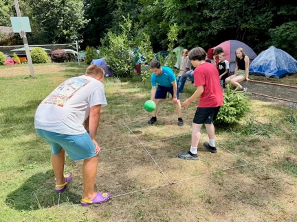 A group of people playing outside

AI-generated content may be incorrect.