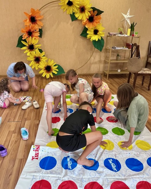 A group of kids playing a game AI-generated content may be incorrect.