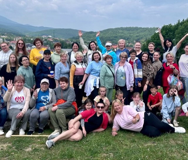 A group of people posing for a photo AI-generated content may be incorrect.