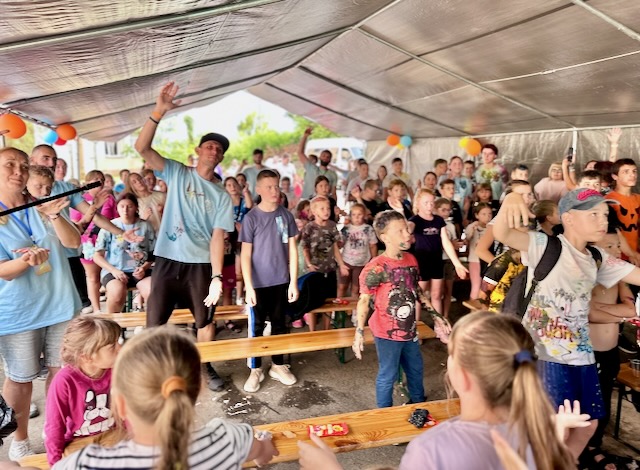 A group of people in a tent AI-generated content may be incorrect.