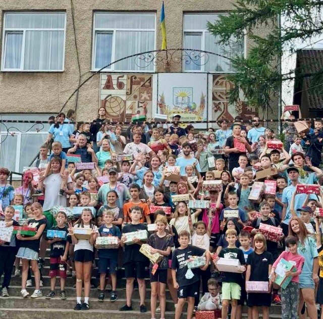 A group of people posing for a photo AI-generated content may be incorrect.