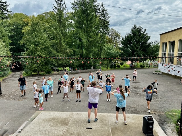 A group of people standing in a circle AI-generated content may be incorrect.