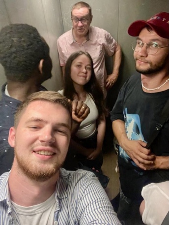 A group of people posing for a photo AI-generated content may be incorrect.