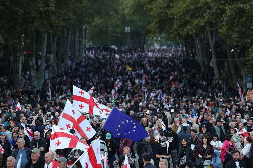 Georgian police crack down on protesters as thousands march on presidential palace