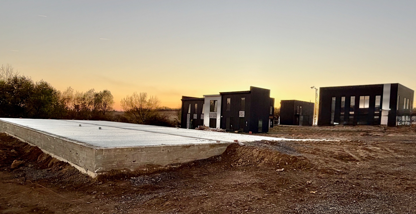 A building under construction with a few buildings

AI-generated content may be incorrect.