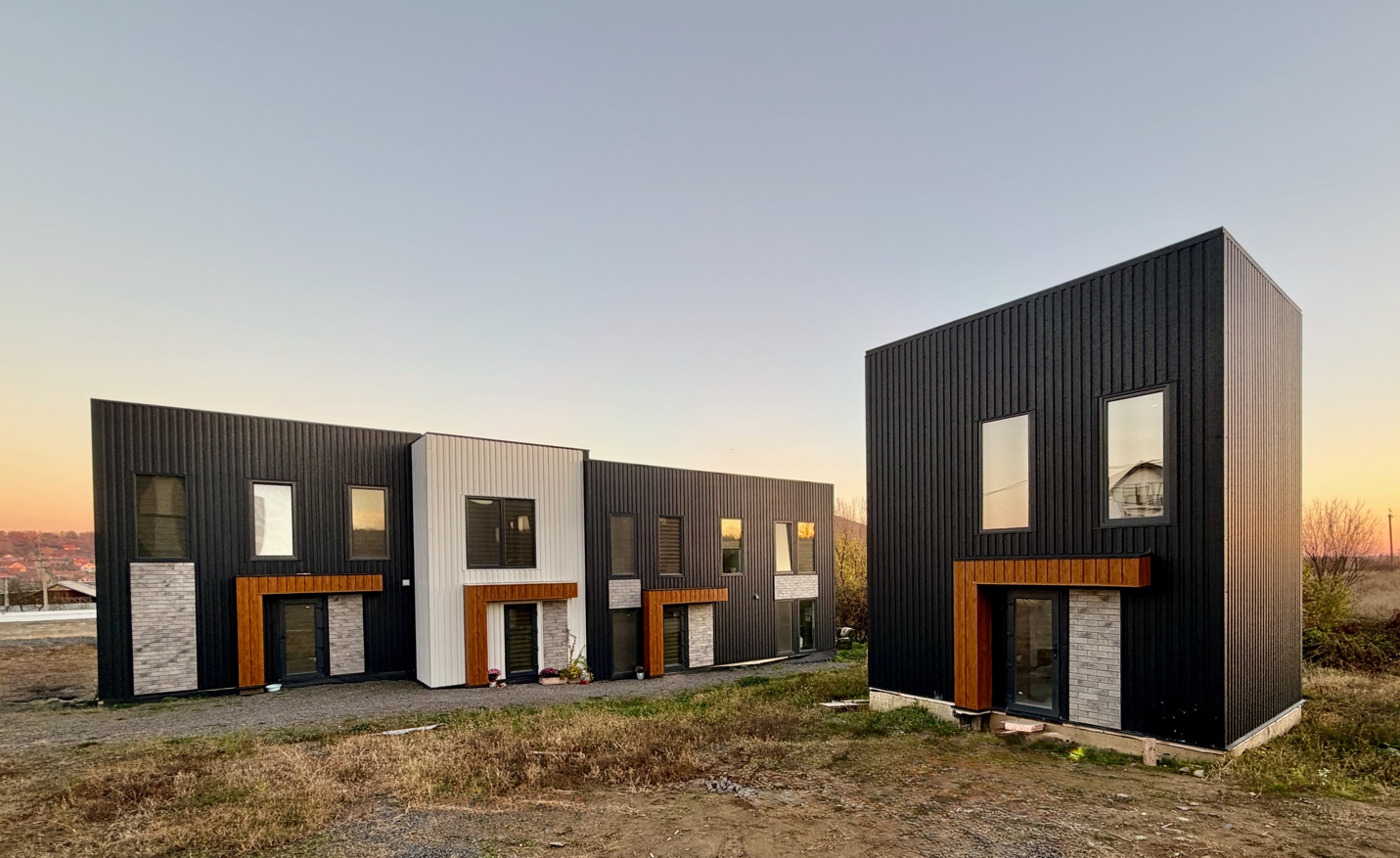 A row of black and white buildings

AI-generated content may be incorrect.