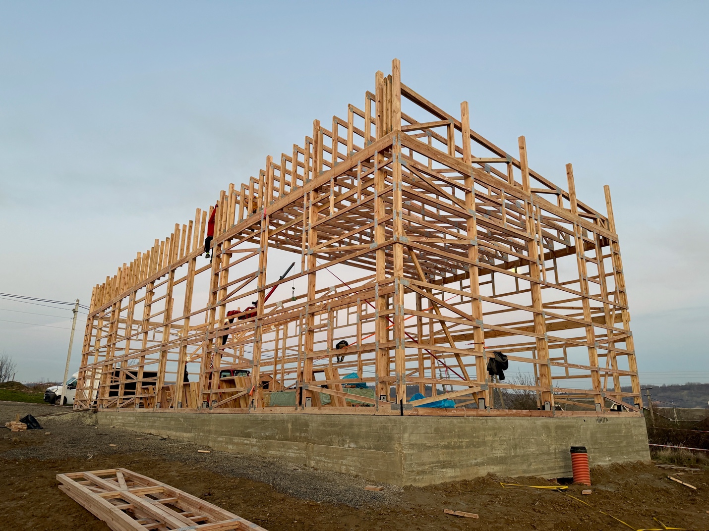 A building under construction with a few workers

AI-generated content may be incorrect.