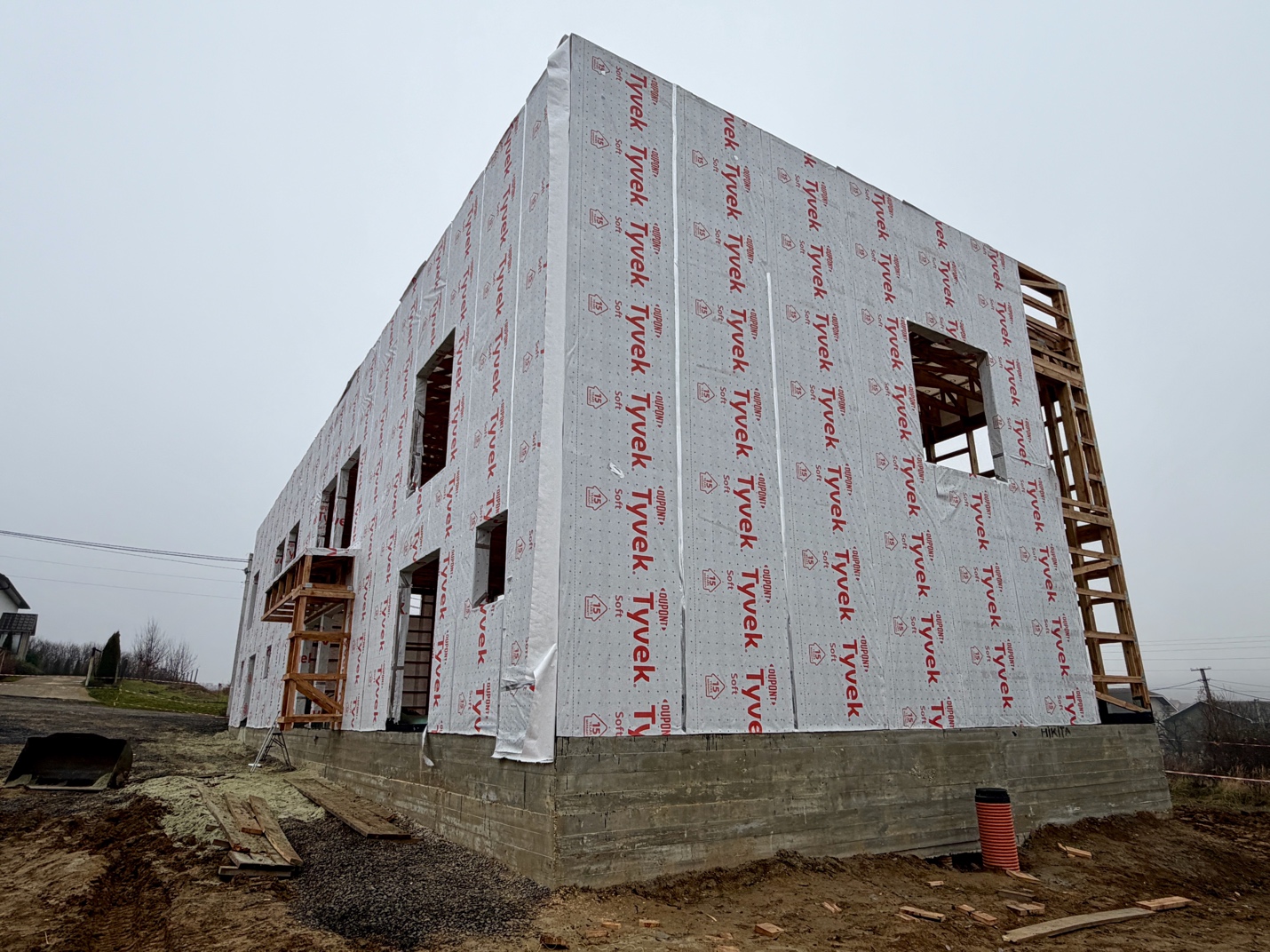 A building under construction with a wooden frame

AI-generated content may be incorrect.