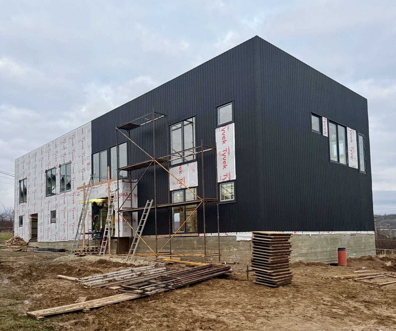 A building under construction with scaffolding

AI-generated content may be incorrect.