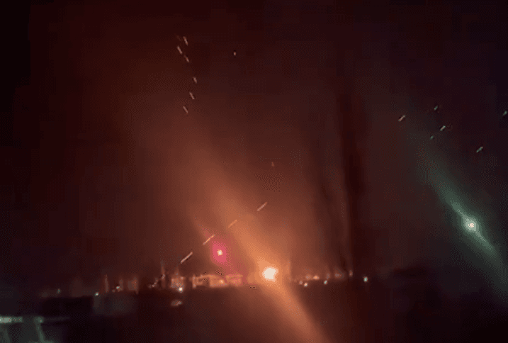 Air defense operating near a facility with what appears to be an explosion