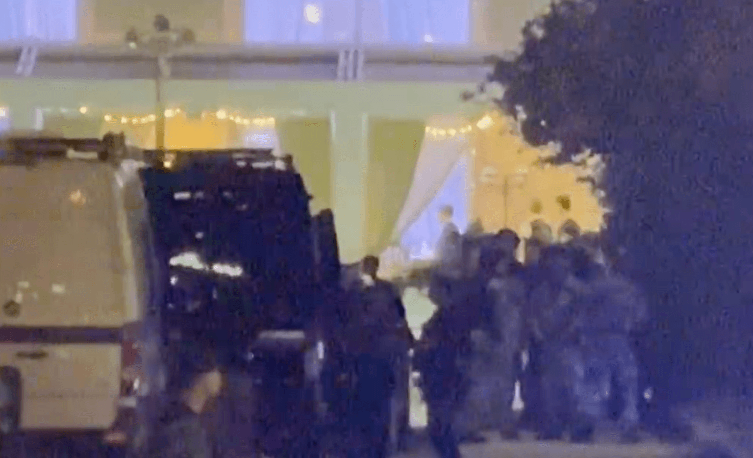 People gathered near a white van